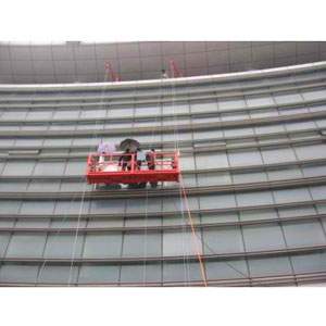 Hanging Platform Set Up At A Building Site Showing Secured Ropes And Steel Frame