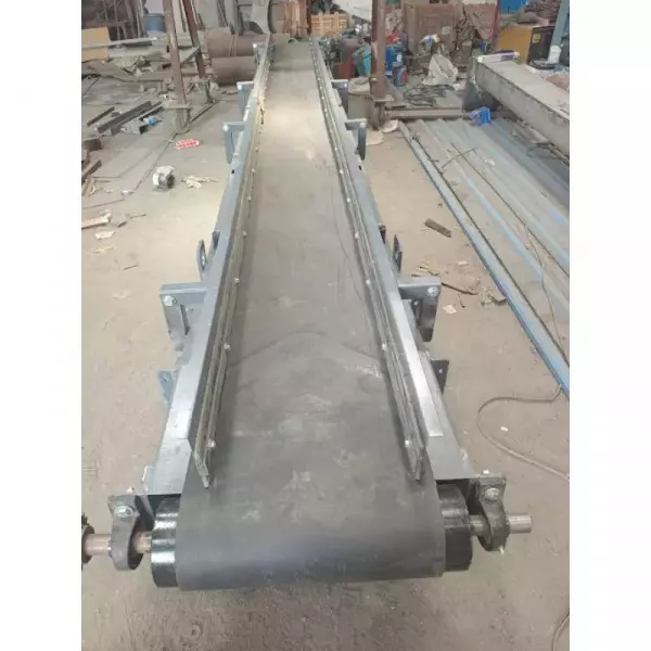 Industrial Belt Conveyor System Transporting Bulk Material At A Manufacturing Plant