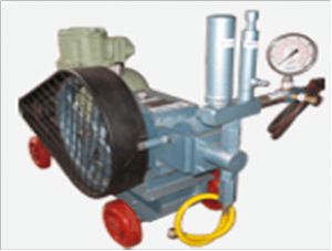 Hydraulic Test Pump Setup Showing Pressure Gauge And Metal Piping