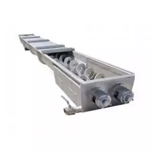 Screw Conveyor Installed In Industrial Setting Showing Metal Trough And Rotating Shaft Transporting Bulk Material