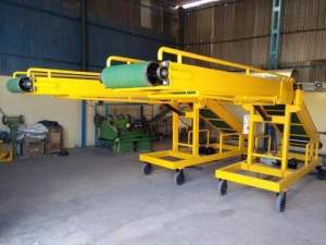 Box Conveyor System Installed In Industrial Facility Showing Conveyor Belt Carrying Boxes