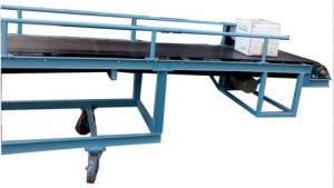 Industrial Conveyor System Transporting Bulk Material In Factory Setting