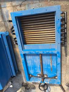 Mechanical Slide Gate Controlling Bulk Material Flow In An Industrial Plant