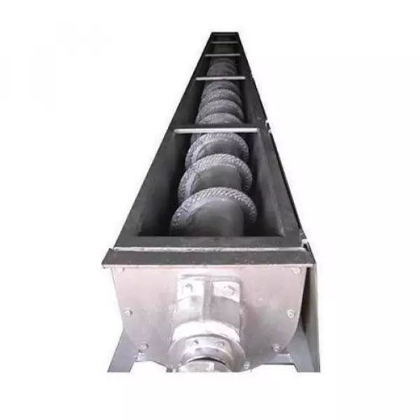Close-up View Of Industrial Screw Conveyor Shaft With Helical Blades Moving Bulk Material