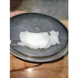 Close Up View Of Thick Petroleum Jelly Applied On Industrial Machine Parts