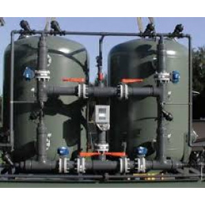 Industrial Demineralization Plant Setup With Filtration Tanks And Control Panel