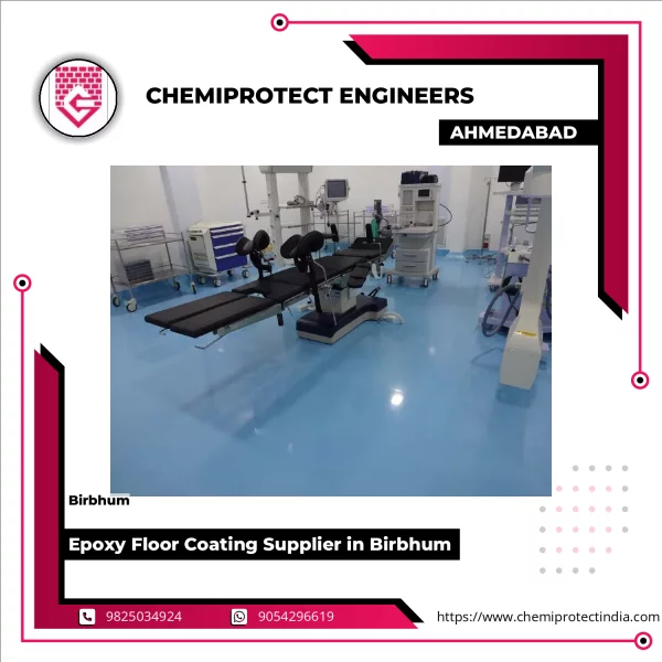 Epoxy Floor Coating Application At An Industrial Plant Showing Worker Applying Resin On Concrete Surface