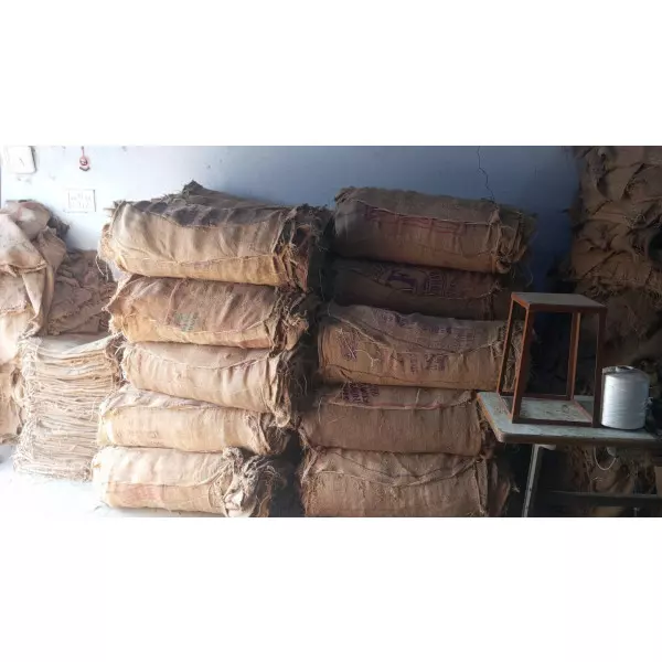 Stack Of Sturdy Woven Jute Bags Arranged For Shipment