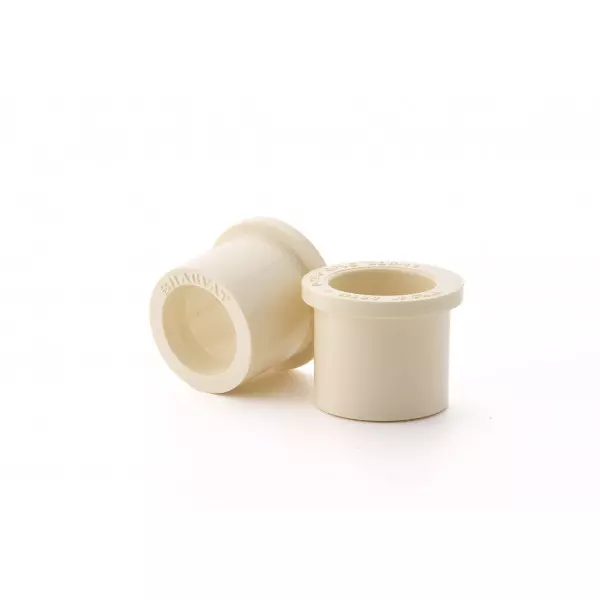 Close-up View Of Yellow CPVC Reducer Bush Fitting Designed For Pipe Size Reduction
