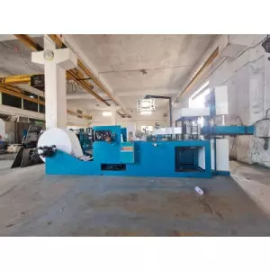 Industrial Tissue Paper Making Machine Setup With Rollers And Conveyor Belts