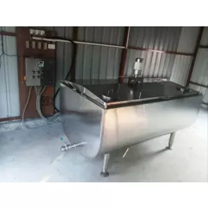 Automatic Milk Chilling Plant Setup At Dairy Farm Showing Stainless Steel Tanks And Control Panel