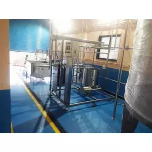 Dairy Plant Machinery Setup Showing Stainless Steel Tanks And Processing Units