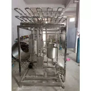 Milk Pasteurizer Plant With Stainless Steel Tanks And Control Panel In Operation