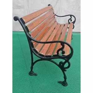 Outdoor Cast Iron Bench Installed In A Public Park