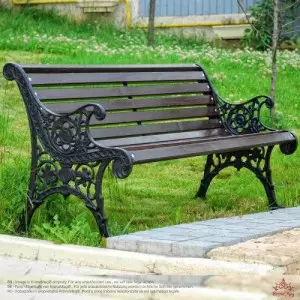 Outdoor Garden Bench Installed In A Green Park Area