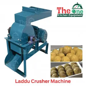 Laddu Crusher Machine Placed On Factory Floor Showing Stainless Steel Body
