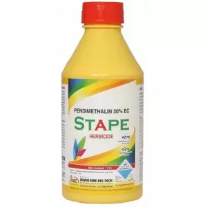 Bottle Of Pendimethalin 30 EC Herbicide Against A Field Background