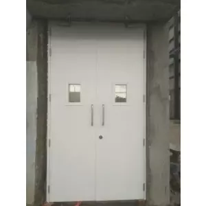 Industrial HMPS Door Installed At Factory Site Showing Metal Frame And Panel