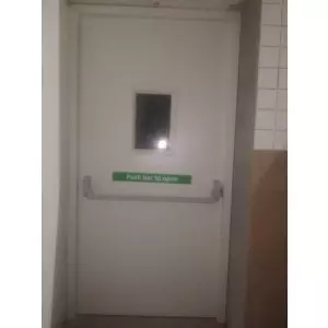 Mild Steel Fire Safety Exit Door Installed In Commercial Building Showing Robust Steel Frame