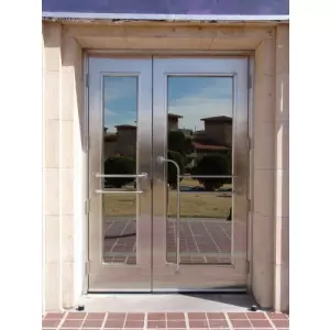 Steel Glazed Door With Glass Panels Installed In Commercial Building