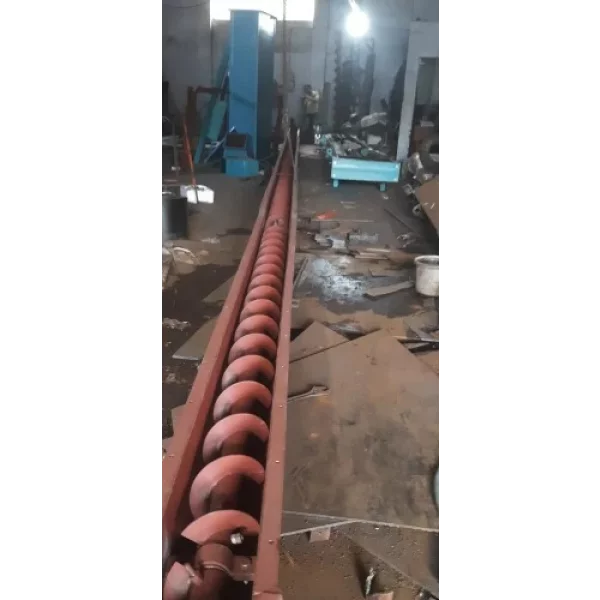 Industrial Cement Screw Conveyor System Operating At A Construction Site