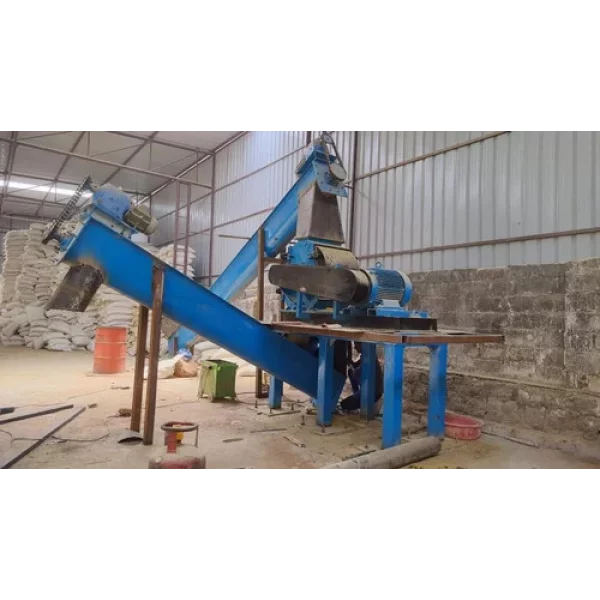 Close-up View Of Screw Conveyor Assembly Showing Rotating Shaft Inside Trough