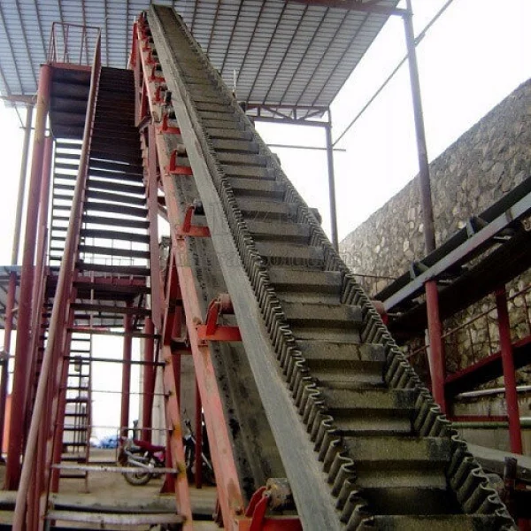Step Angle Conveyor Installed At Industrial Facility Showing Inclined Bulk Material Movement