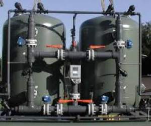 Industrial Filtration Plant Setup With Stainless Steel Filter Housings And Control Panel