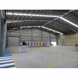 Prefabricated Steel Shed Components Arranged For Transport At An Industrial Site