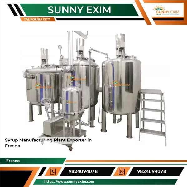 Syrup Manufacturing Plant Machinery Setup Showing Stainless Steel Tanks And Automated Filling Line