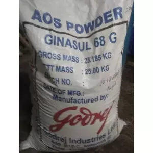 Close-up View Of White Granular AOS Powder In A Bulk Container