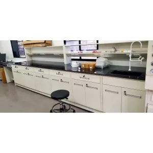 Laboratory Island Bench With Modular Cabinets And Integrated Utilities In A Research Lab