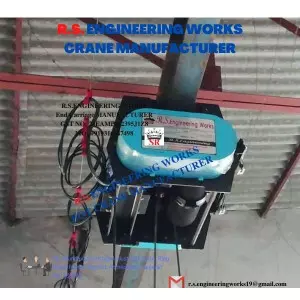 Motorized Trolley Attached To Chain Hoist Lifting Heavy Industrial Load