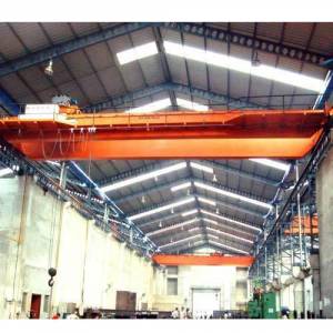 Industrial Double Beam EOT Crane Lifting Heavy Load At Construction Site