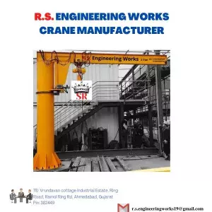 Pillar Mounted Jib Crane Installed In An Industrial Workshop Showing Its Main Arm Swinging Over The Working Area