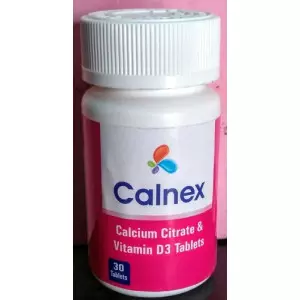 Close-up Of Calcium Citrate Tablets Arranged On A White Surface