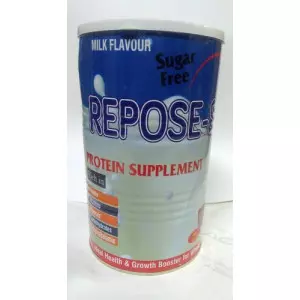 Sugar Free Protein Supplement Powder Jar With Scoop Beside It