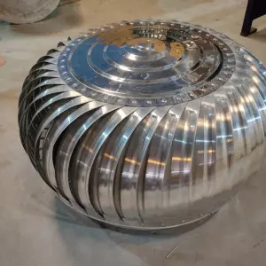 Aluminium Air Ventilator Installed On Industrial Roof Against Clear Sky