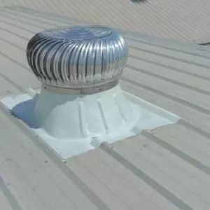 Industrial Turbo Ventilator Installed On Factory Roof Spinning In Wind