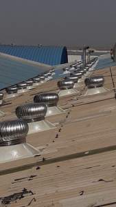 Roof Top Air Ventilator Installed On Factory Roof Showing Durable Metal Blades