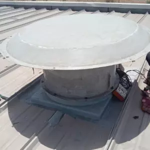 Rooftop Extractor Fan Installed On Factory Roof Showing Ventilation System