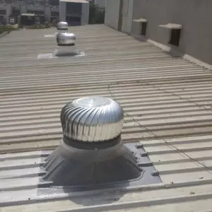 Stainless Steel Roof Ventilator Installed On Industrial Building Rooftop