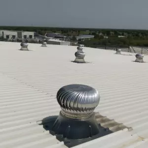 Wind Driven Ventilator Installed On Factory Roof