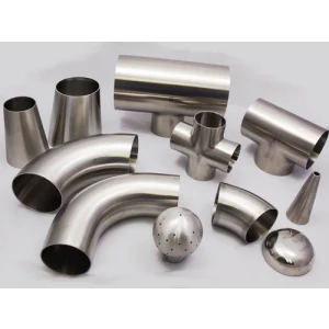 Close-up View Of Stainless Steel Pipe Fittings Arranged On A Workbench