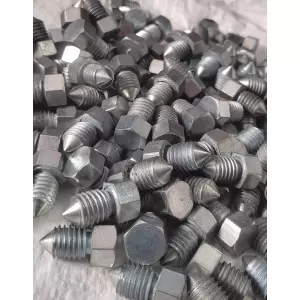 Close-up View Of Lock Shear Bolt Showing Threading Detail On Steel Surface