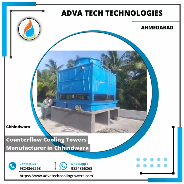 Industrial Counterflow Cooling Tower In Operation With Water Vapor Rising