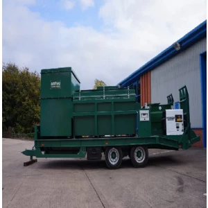 Portable Waste Incinerator Unit Operating Outdoors At A Remote Site