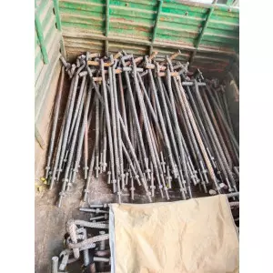 Foundation Bolts Arranged For Inspection Showing Threading And Weld Quality