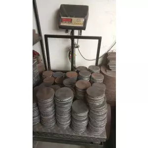 Stack Of Mild Steel Circles Arranged On Factory Floor