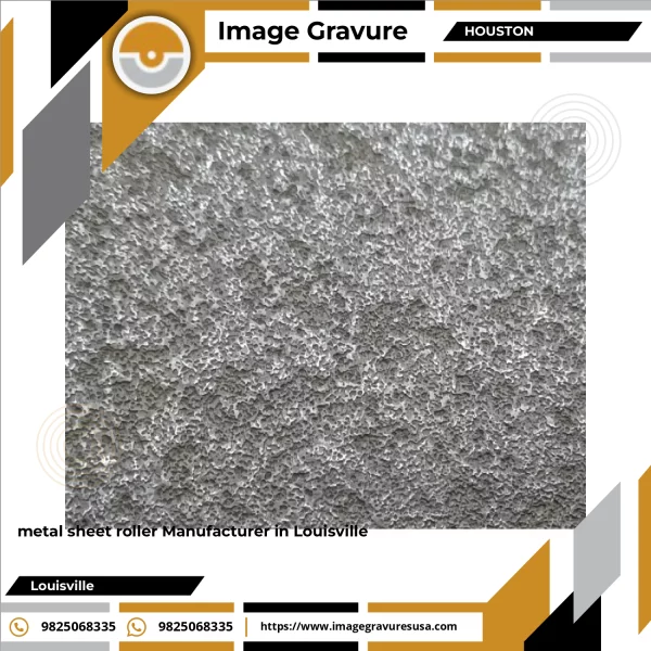 Close-up View Of A Precision-engineered Metal Sheet Roller Showing Engraved Surface Texture